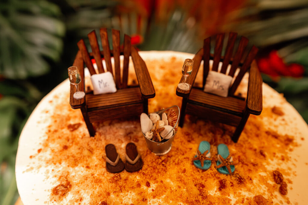 Custom wedding cake décor with beach chairs and ocean theme at Hotel Nacional wedding