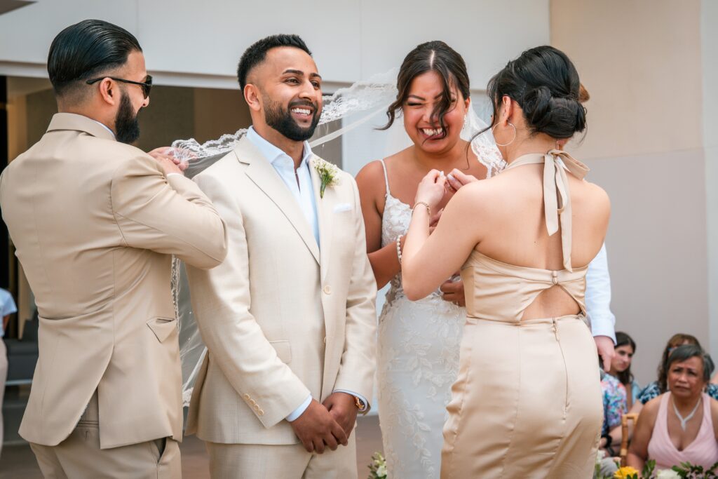 The couple smiles upon arriving and getting a hand after saying “I do” in Varadero