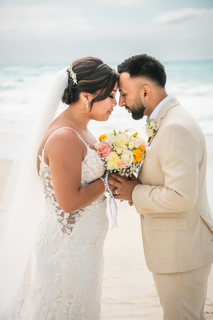 The couple, eyes closed and foreheads touching, during their photo session in Varadero.