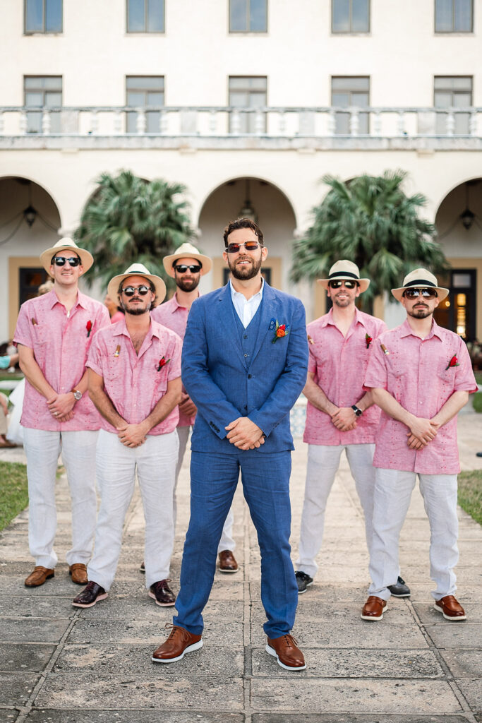 The groom and his wedding party pose at the Havana hotel before the ceremony