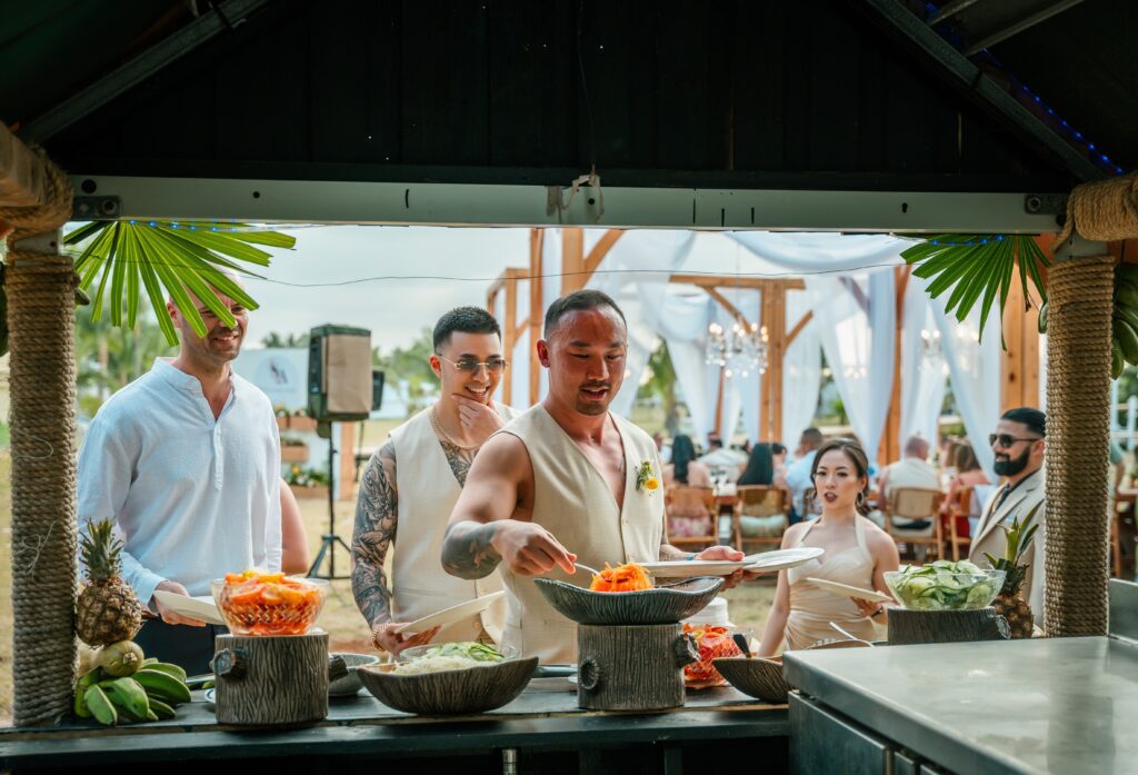 Several guests serve themselves at the show cooking station in Varadero