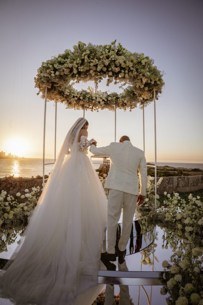 gazebo-decorated-with-flowers-in-front-of-el-morro-wedding-decoration-work-in-cuba