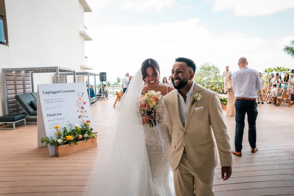 The couple walks hand in hand as they leave the ceremony area in Varadero.