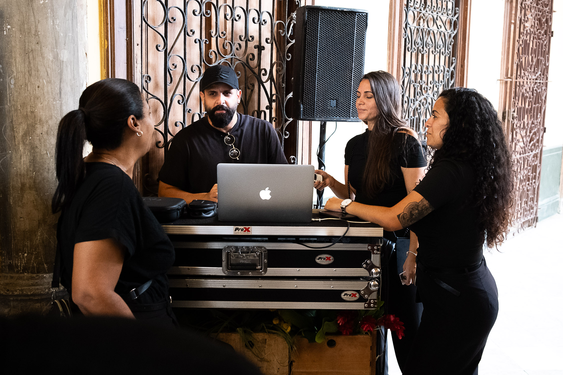Coordination reviewing the wedding program with the DJ during the reception in Cuba.