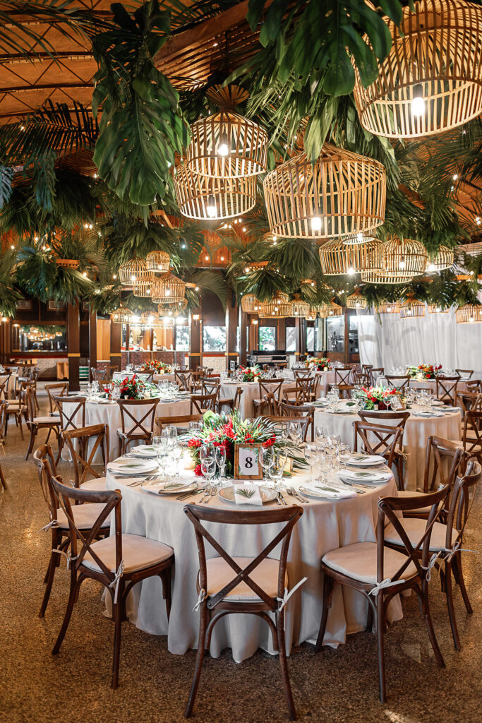 Wedding décor with hanging lamps, tropical flowers and wood accents at the Hotel Nacional