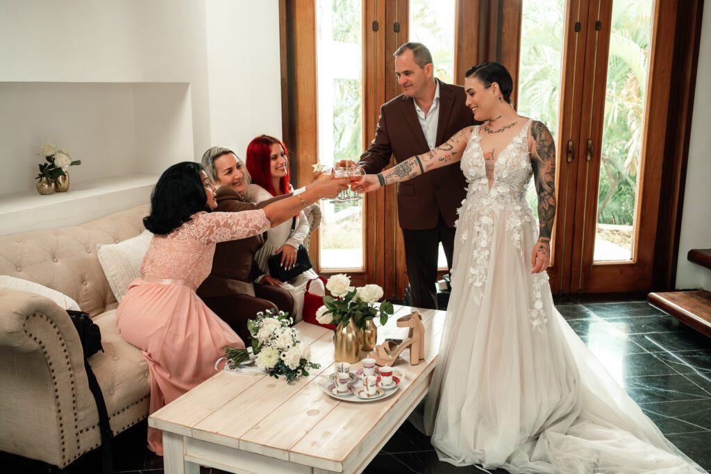 Sheyla toasts with her mother, father, and other relatives at her wedding in Cuba