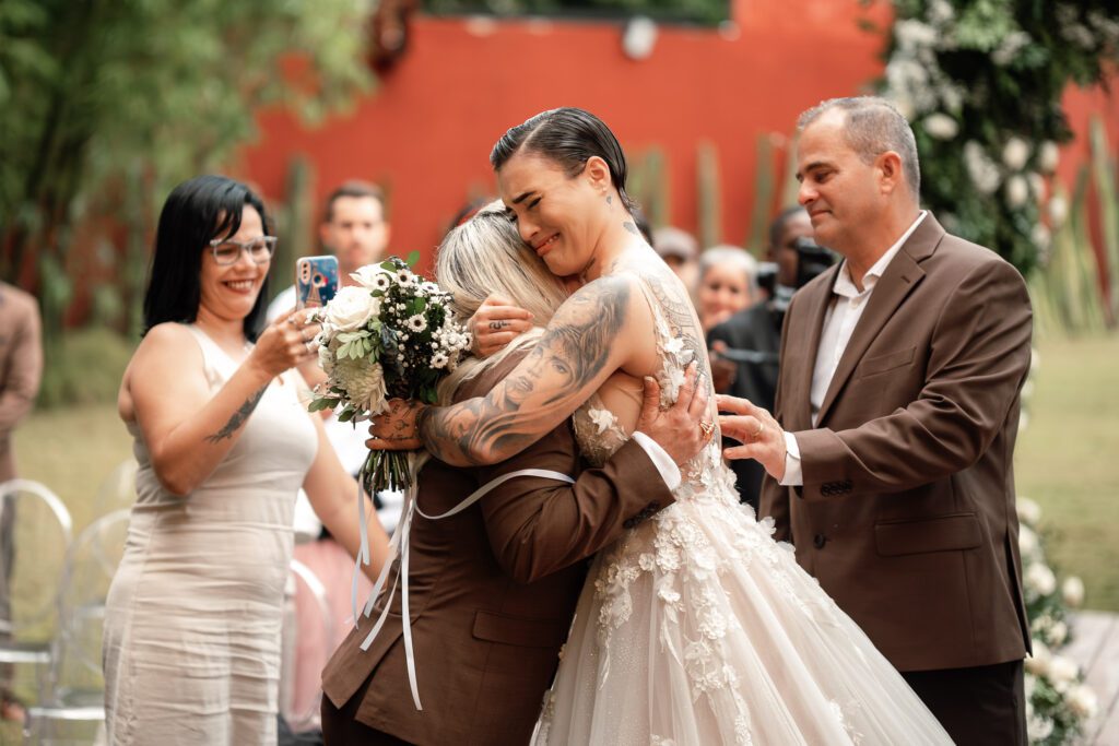 Sheyla hugs her mother with emotion upon reaching the altar at the ceremony in Havana