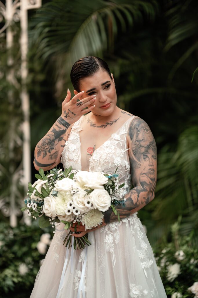 Sheyla cries, moved, as she listens to an audio during her wedding ceremony in Cuba under the most beautiful dome